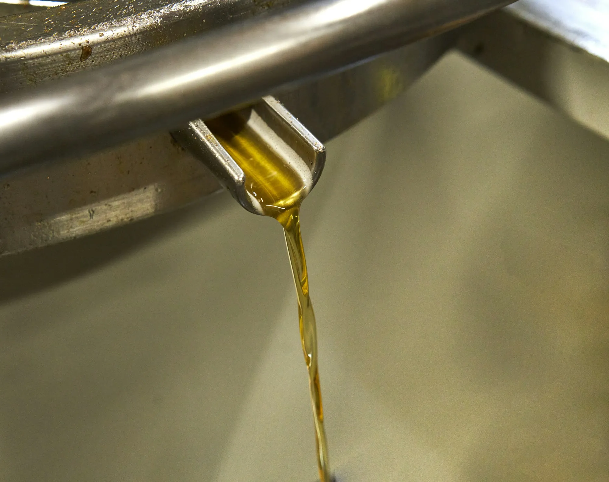 Motor oil pouring into an engine from a can